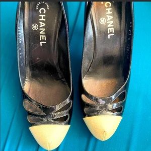 ISO Chanel black  irredesent patent cream cap toe with cut outs high heels